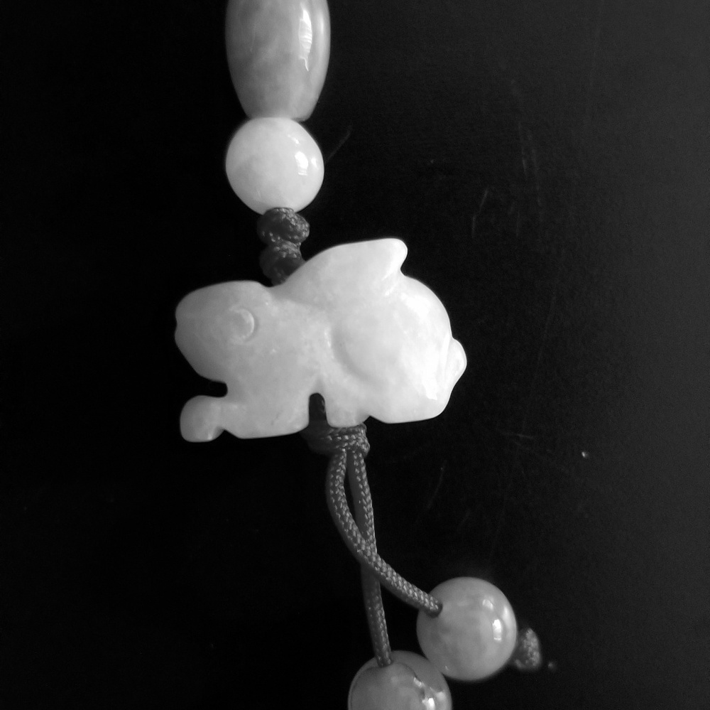 Hand carved white jade lucky rabbit charm